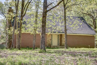 This home sits midway back on the property, a fine home in need of some final touches!