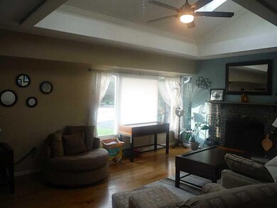 Living Room. Skylights and tray ceilings really ma
