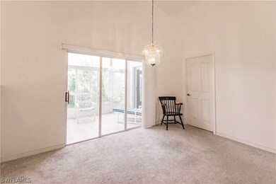Spare room with a notable chandelier, light colore