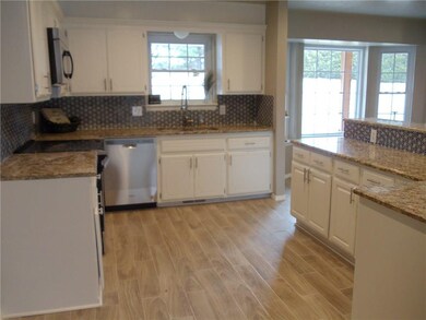 View of kitchen. New granite counter tops, cabinet