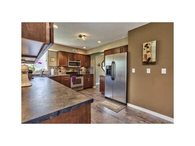 Kitchen. STAINLESS APPLIANCES, GRANITE SINK, AND U