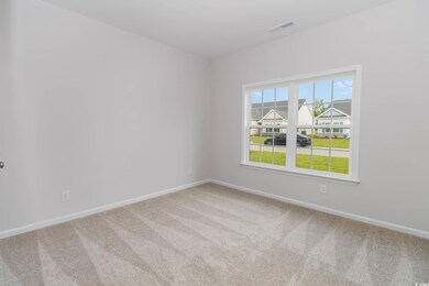 Unfurnished room featuring carpet flooring