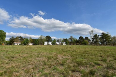 View of yard with a rural view
