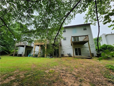 Rear view of property featuring a yard