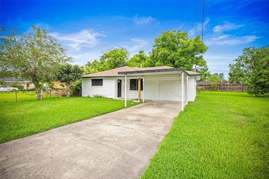 Extra long driveway and carport great for a multi-