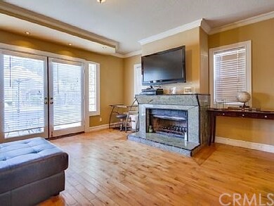 Living room with fireplace and TV