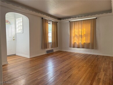 Great room featuring hardwood / wood-style floors and a textured ceiling
