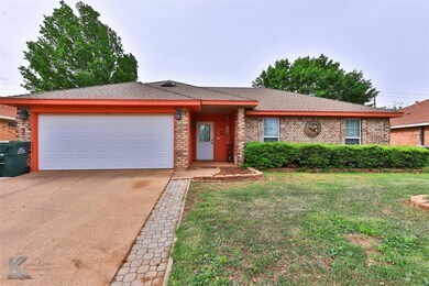 View of front of property with a front yard and a 