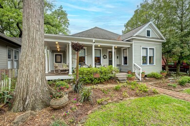 Pine tree frames the front yard with smart native
