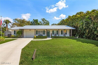 Single story home featuring driveway, stucco sidin