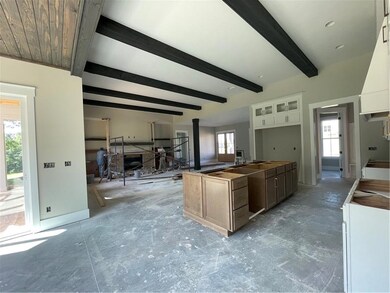 Kitchen with white cabinets, glass insert cabinets