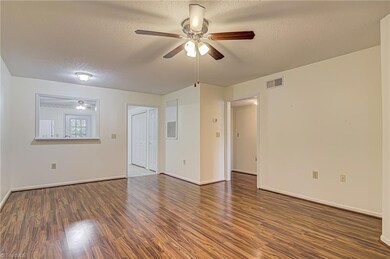Smooth transition between living areas! Middle doorway leads to two large bedrooms.