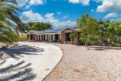 Ranch-style house featuring covered porch, brick s