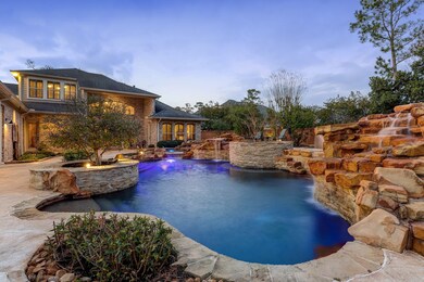Another view of the STUNNING backyard oasis from the end of the pool looking back towards the house.