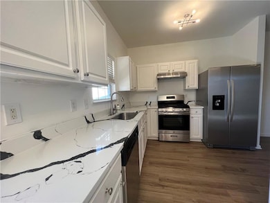 Stunning Quartz countertops have been added along 