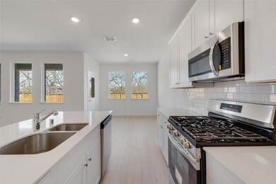Kitchen featuring appliances with stainless steel 