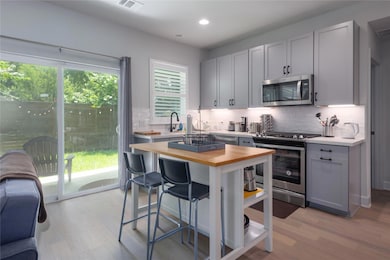 Kitchen featuring appliances with stainless steel