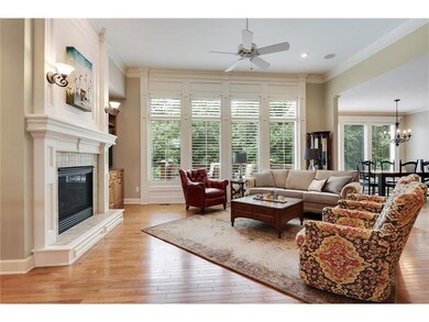The family room is open with lots of windows to vi