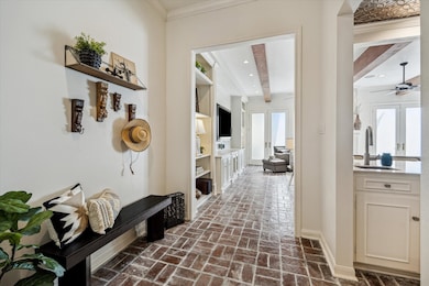 The Brick-paved Entry leads to fresh first floor Living spaces.