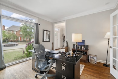 Lovely hardwood floors and picture windows greet you upon entering the foyer.