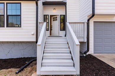 Property entrance featuring a garage