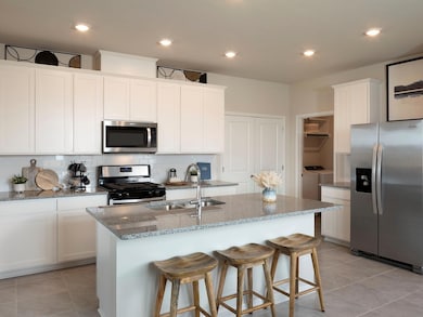 Kitchen featuring stainless steel appliances, a s