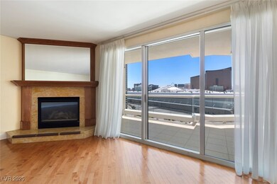 Living area featuring wood finished floors and a h