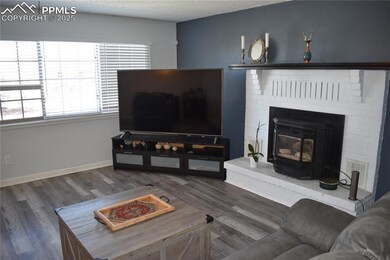 Living area with wood finished floors, a wood stov