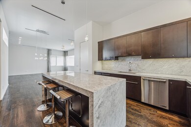 With more storage and counter space than you can dream of, this kitchen is the perfect complement to the second floor. The open concept provides easy entertaining flow.