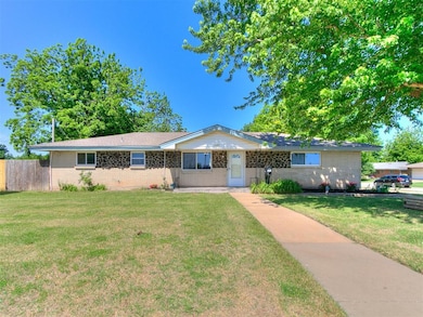 Single story home with brick siding