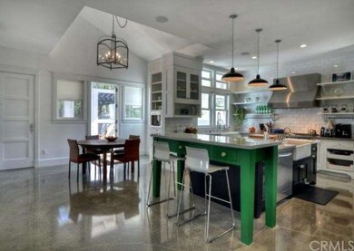 Spacious kitchen and eating area leading to screen