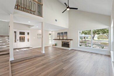 VAULTED family room with FIREPLACE and hearth
