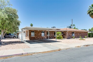 Exterior Front of home with 2-car carport, desert