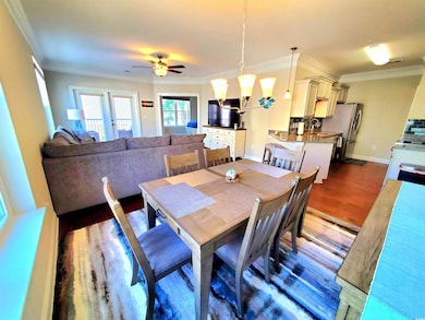 Dining area featuring crown molding, sink, ceiling