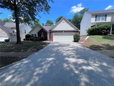 View of front of property with brick siding, drive
