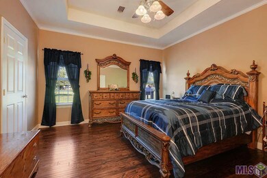 Master bedroom located at the back of the home fea
