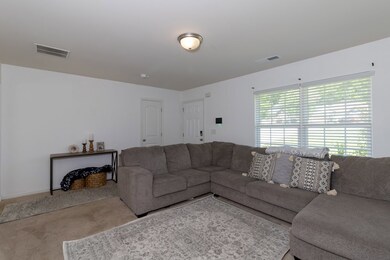 Living room with half bath by front door