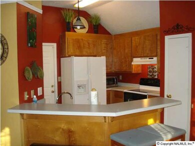 Kitchen offers lots of cabinets. counter tops, Brkfst bar and opens to the Brkst area and cozy Family room.
