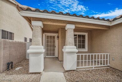 Entrance to property with a tile roof, fence, and