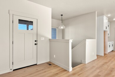 Entrance foyer featuring light wood finished floors