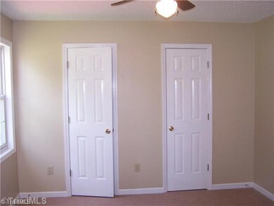 Master Bedroom. Master Bedroom features a large closet that spans the width of the room, ceiling fan, new carpet, fresh paint, and a full bath!! Overlooks private back yard and large deck!