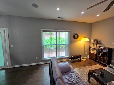 Living area featuring ceiling fan, wood finished floors, recessed lighting, and baseboards