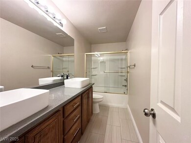 Full bathroom with double vanity and shower / bath