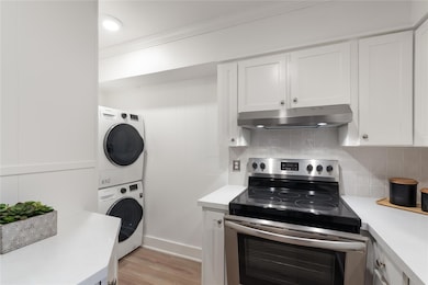Kitchen with stainless steel range with electric 