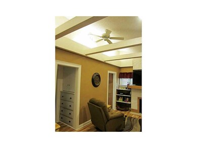 Family Room. The open beams give it a rustic yet m