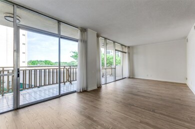 Floor to ceiling windows span the living-dining ar