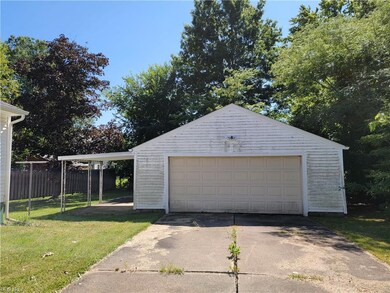 Garage with garage and a yard