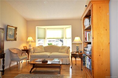 Great Room has hardwood floors and bay window.