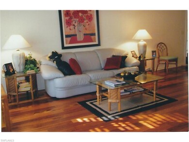 SPACIOUS LIVING ROOM AREA WITH GORGEOUS HARD WOOD 