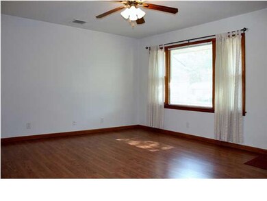 Open living room with laminate floors.